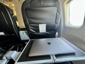 Northern Pacific Airways first class tray table with laptop